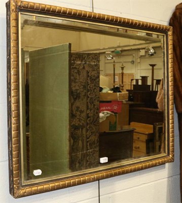 Lot 1188 - A rectangular gilt framed wall mirror with bevelled glass plate