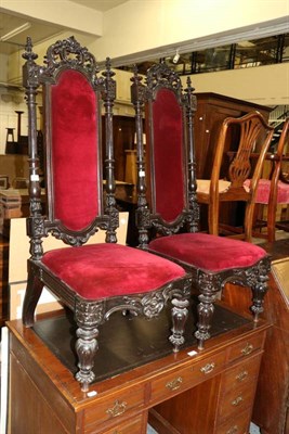 Lot 1201 - A pair of carved high backed side chairs