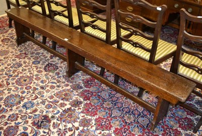 Lot 1202 - A long school bench