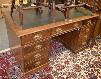 Lot 1205 - A mahogany leather inset partners pedestal desk