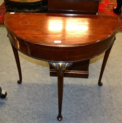 Lot 1232 - A mahogany D-shaped fold over card table