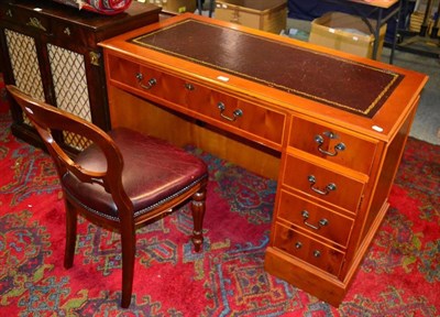 Lot 1236 - A reproduction cherrywood desk with leather insert and chair