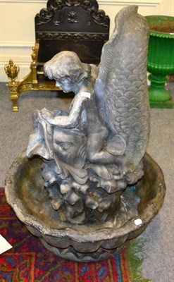 Lot 1239 - A composition garden fountain modelled as a putto riding a dolphin