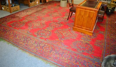 Lot 1245 - An Ushak Carpet of unusual size, West Anatolia, the tomato red field of medallions enclosed by...