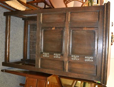 Lot 1250 - An oak cupboard on stand