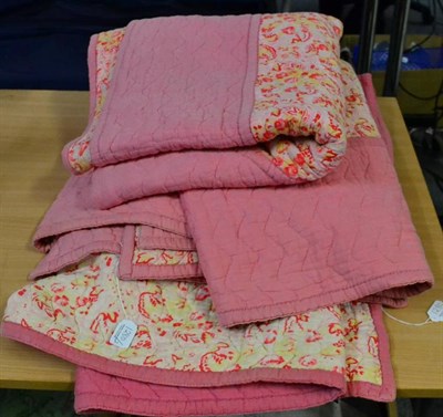 Lot 1280 - Circa 1930s pink cotton and pink rose reversible quilt, with central diamond, labelled The...