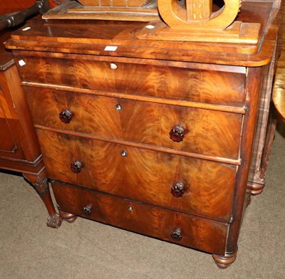 Lot 1287 - A four height mahogany chest of drawers on turned supports and top cushion drawer