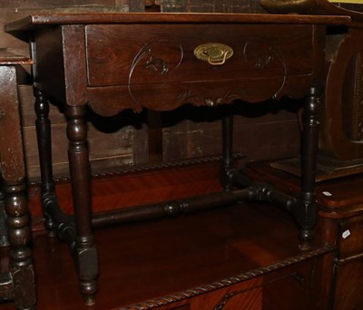 Lot 1288 - An oak side table fitted with on drawer