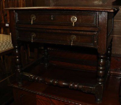 Lot 1289 - A joined oak two drawer table