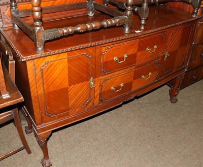 Lot 1290 - A mahogany sideboard on cabriole supports with ball and claw feet