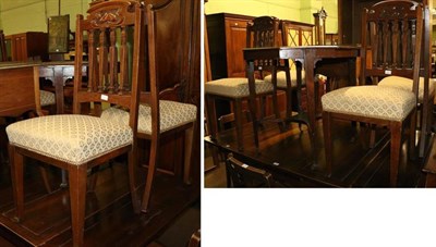 Lot 1292 - An Edwardian rosewood octagonal centre table and a set of four dining chairs with Art Nouveau...