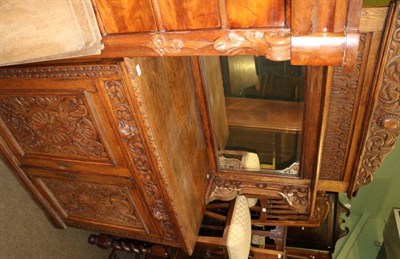 Lot 1294 - A carved oak mirror back sideboard