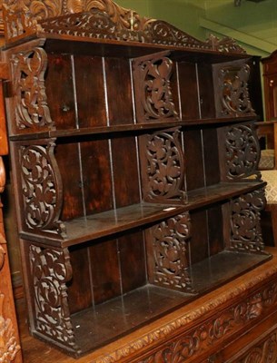 Lot 1295 - A fret carved set of hanging shelves