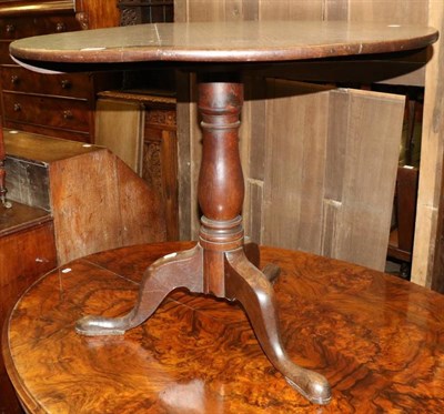 Lot 1303 - An oak tilt top tripod table