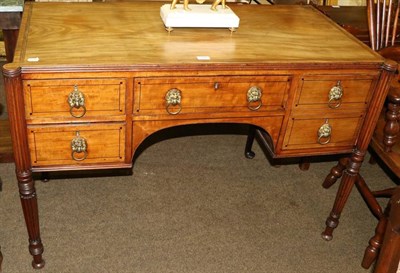 Lot 1326 - A Regency mahogany and crossbanded kneehole sideboard, the central drawer flanked by two...