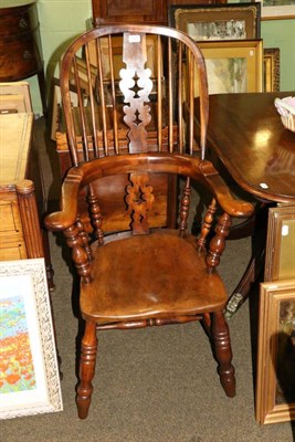 Lot 1327 - A 19th century yew Windsor armchair