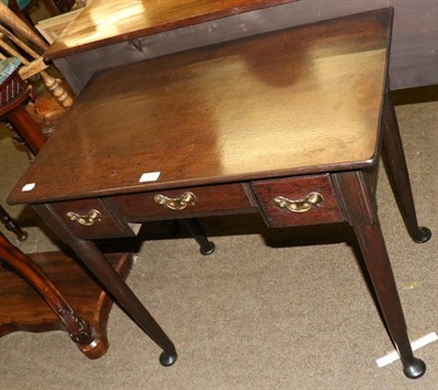 Lot 1331 - An 18th century oak lowboy