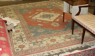 Lot 1343 - Anatolian Carpet, late 20th century, the coral pink field centred by an ivory medallion framed...