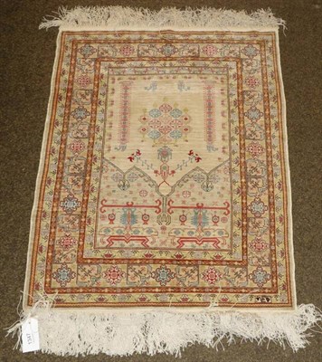 Lot 1347 - A silk hereke Prayer rug North West Anatolia, the cream field beneath a triple Mihrab enclosed...