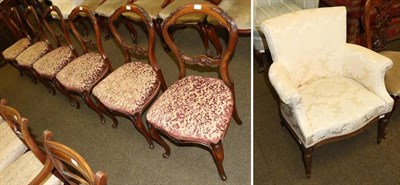 Lot 1352 - An upholstered armchair with serpentine front on fluted supports