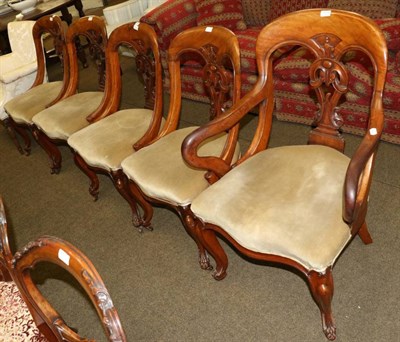 Lot 1354 - A set of five mahogany dining chairs, the front cabriole supports with ball and claw feet