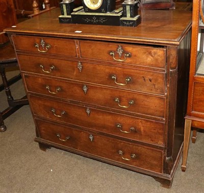 Lot 1364 - A George III mahogany secretaire chest, late 18th century, the fall front enclosing a fitted...