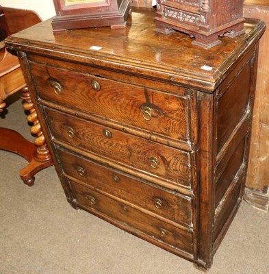 Lot 1368 - An oak panel four height chest of drawers