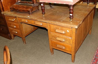 Lot 1372 - An early 20th century oak partners desk (a.f.)