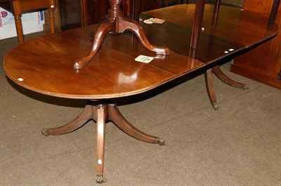 Lot 1374 - A George III twin pedestal dining table and leaf