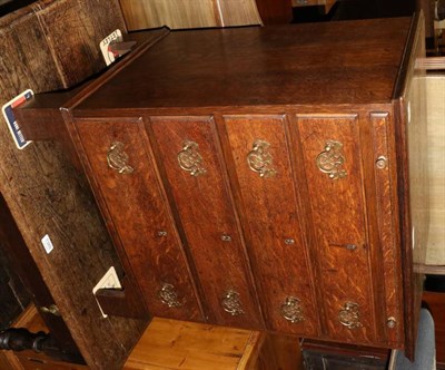 Lot 1388 - A George III oak four height chest of drawers fitted with a dressing slide