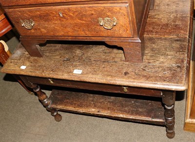 Lot 1389 - An 18th century oak table with drawer