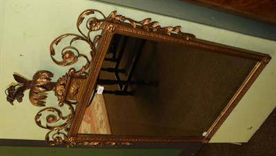 Lot 1401 - An Adam style gilt and gesso wall mirror, surmounted by elaborate foliate scrollwork,...