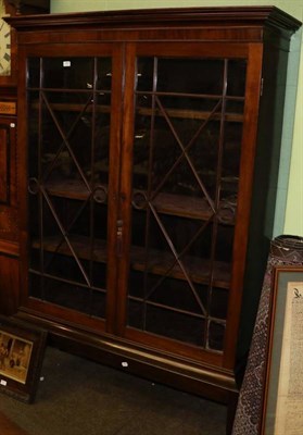 Lot 1409 - A glazed mahogany display cabinet