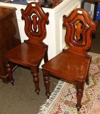 Lot 1414 - A pair of mahogany hall chairs