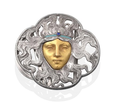 Lot 197 - An Art Nouveau Belt Buckle, by Lalique, as a female face within an oxydized pierced quatrefoil...