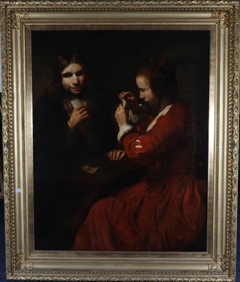 Lot 56 - After Rembrandt Harmenszoon van Rijn (1606-1669) Dutch A young man and a girl playing cards  Oil on