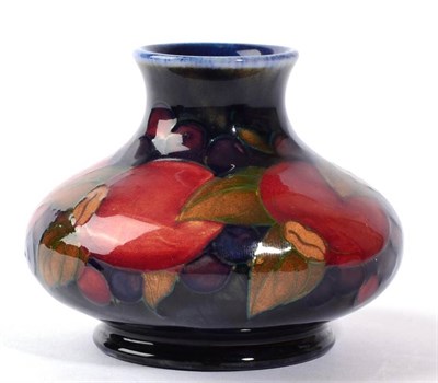 Lot 227 - William Moorcroft (1872-1945): A Pomegranate Pattern Vase, on a blue ground, impressed MADE IN...