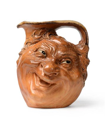 Lot 235 - A Martin Brothers Stoneware Face Jug, by Robert Wallace Martin, dated 1903, modelled in relief with