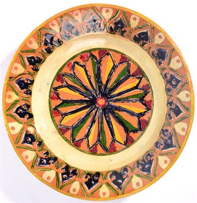 Lot 237 - A Della Robbia Pottery Earthenware Dish, decorated with repeating patterns, in green, yellow,...