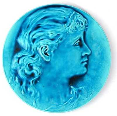 Lot 245 - A Burmantofts Faience Pottery Circular Plaque, moulded with the portrait profile of a girl, under a
