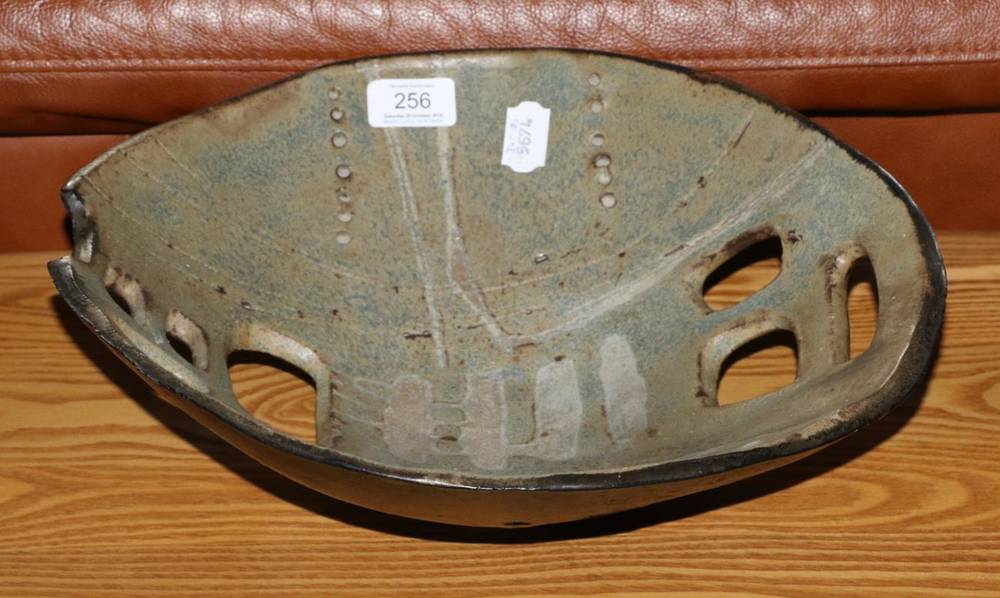 Lot 256 - Joe Tetteh (Ghanaian, 20th century): A Reticulated Studio Pottery Bowl, mottled glaze, incised...