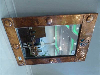 Lot 295 - An Arts and Crafts Enamel and Copper Framed Rectangular Mirror, the hand beaten frame with embossed