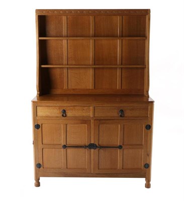 Lot 303 - Mouseman: A Robert Thompson English Oak 4ft Welsh Dresser, the top with two fixed plate racks,...