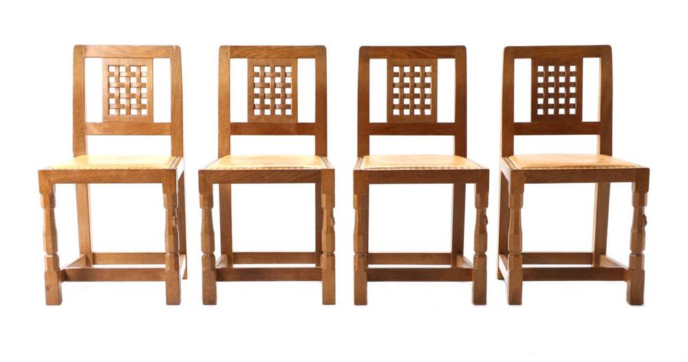 Lot 306 - Mouseman: A Set of Four Robert Thompson English Oak Lattice Back Dining Chairs, nail tan hide...