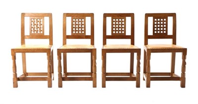 Lot 306 - Mouseman: A Set of Four Robert Thompson English Oak Lattice Back Dining Chairs, nail tan hide...