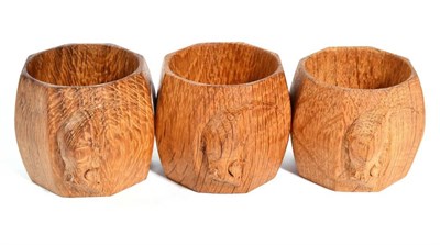 Lot 312 - Mouseman: Three Robert Thompson English Oak Napkin Rings, of octagonal form, each with carved mouse