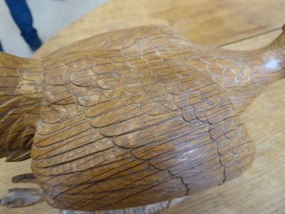 Lot 313 - Mouseman: A Robert Thompson Carved English Oak Pheasant, in a running pose, with carved mouse...