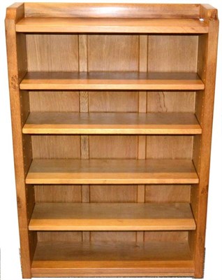 Lot 320 - Mouseman: A Robert Thompson English Oak 4ft Open Bookcase, with raised upstand, solid ends and...