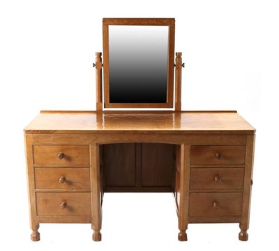 Lot 322 - Mouseman: A Robert Thompson English Oak Dressing Table, with fixed central pivoting rectangular...