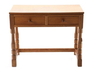 Lot 324 - Mouseman: A Robert Thompson English Oak Hall Table, the rectangular top above two drawers, on...